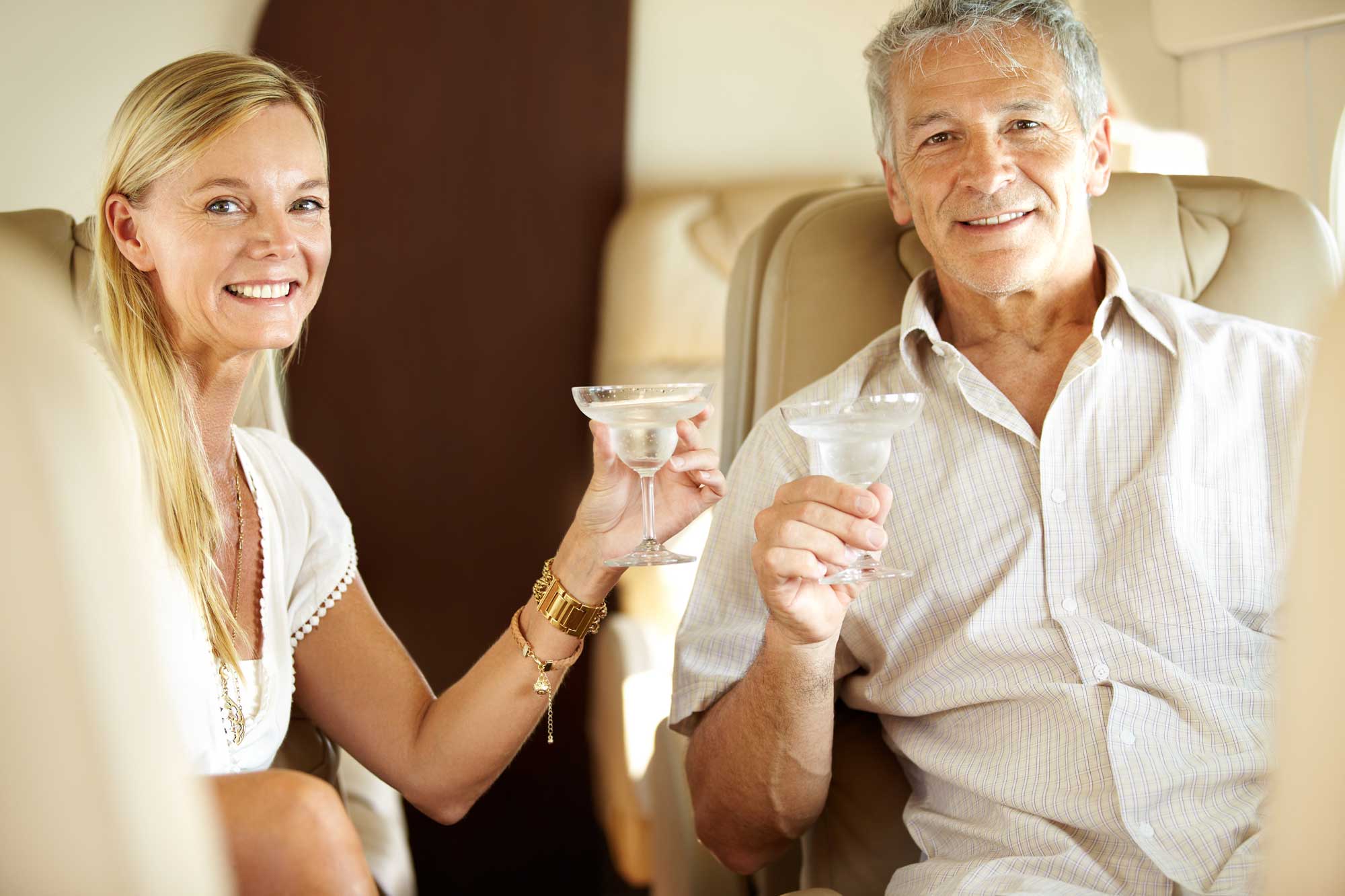 happy-couple-and-champagne-in-private-jet